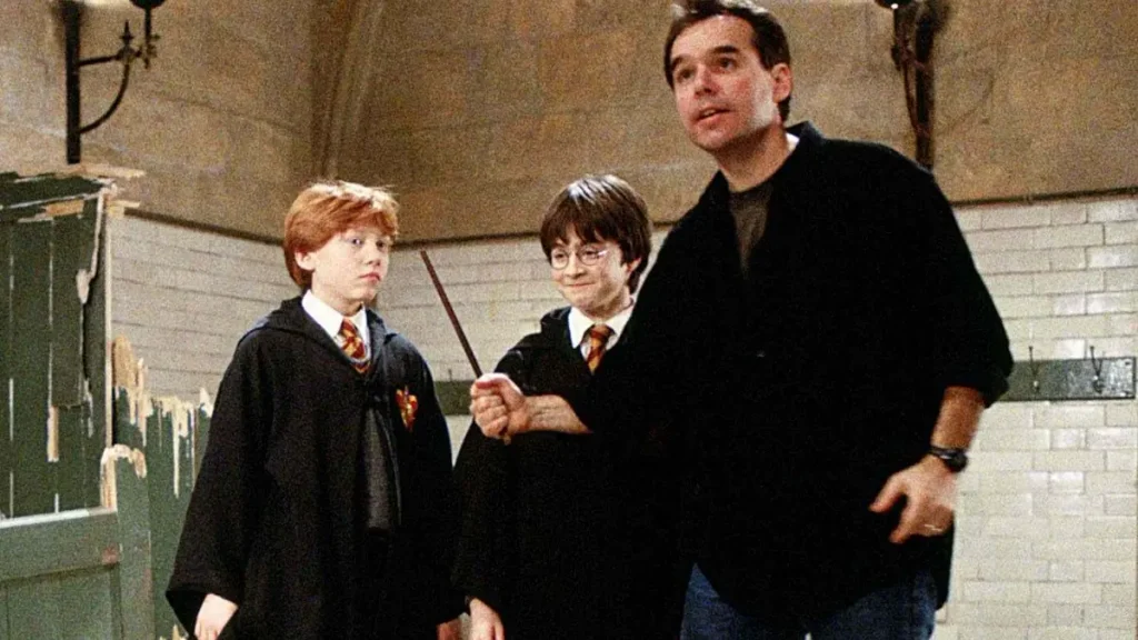 Chris Columbus junto Rupert Grint y Daniel Radcliffe